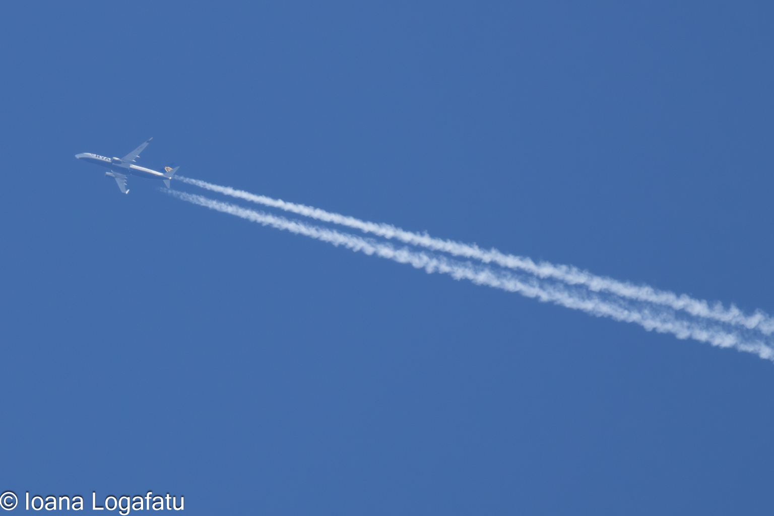 Jet soaring through a clear blue sky